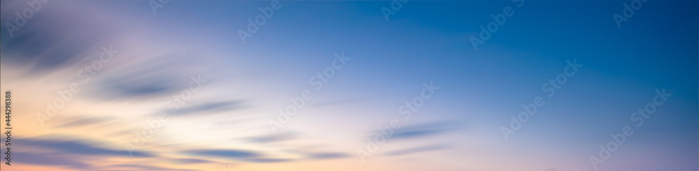Obraz premium Beautiful summer sky sunset, blue, yellow and red, a sense of peace. The feeling of youth nostalgia.