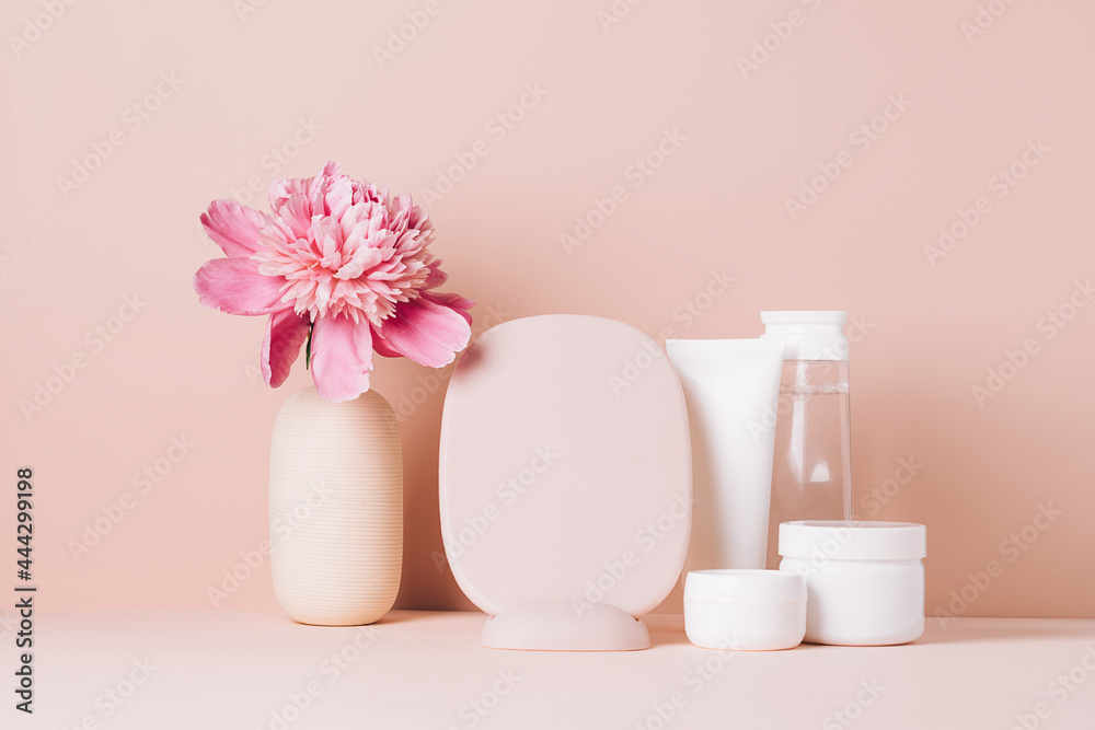 Women's accessories mirror cream oil various cosmetics on a table with flowers. Body and face care health beauty concept Women's accessories mirror cream oil various cosmetics on a table with flowers. Body and face care health beauty concept