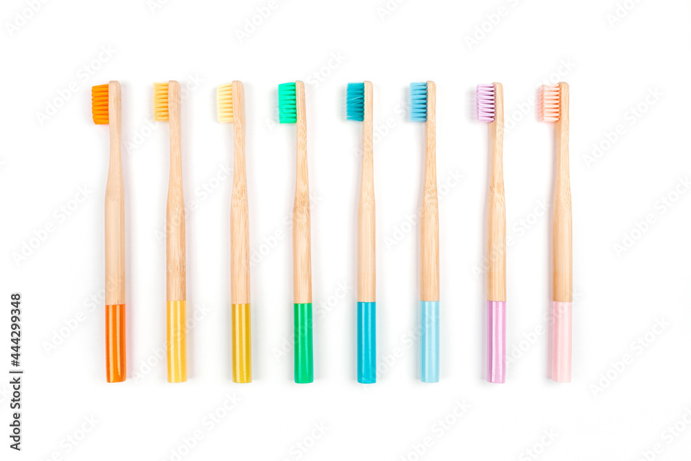 Flatlay with colorful wooden bamboo toothbrushes Flatlay with colorful wooden bamboo toothbrushes