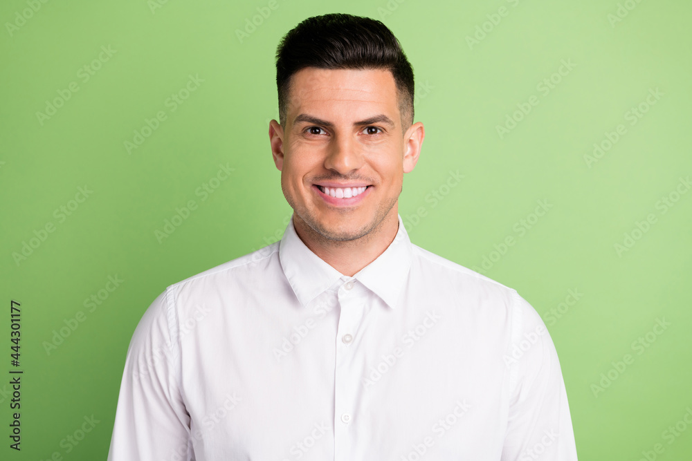 Photo of handsome cheerful brunet businessman toothy beaming smile wear white shirt isolated green color background Photo of handsome cheerful brunet businessman toothy beaming smile wear white shirt isolated green color background
