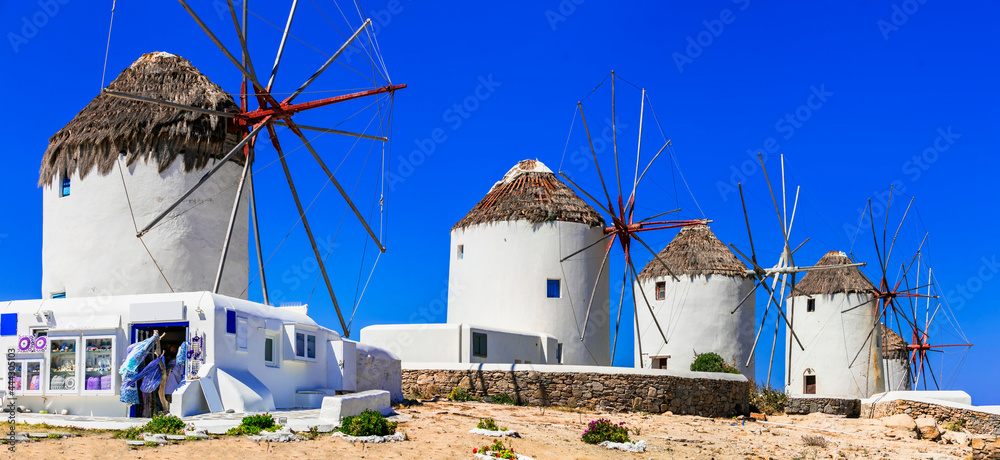 Traditional Greek windmills. Mykonos island, Cyclades. Greece travel and landmarks - obrazy, fototapety, plakaty 