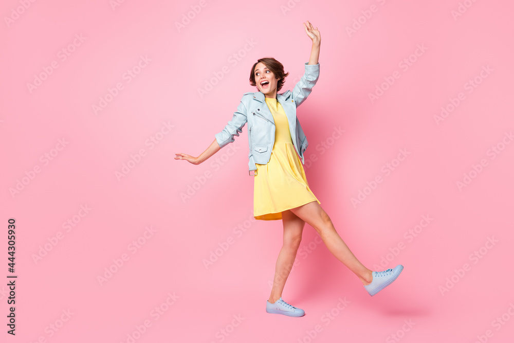 Full length photo of funny pretty young girl turquoise walking dancing isolated pink color background Full length photo of funny pretty young girl turquoise walking dancing isolated pink color background