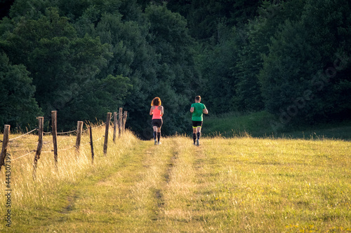 two people walking in the park