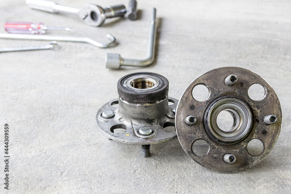 Old Wheel Bearings at remove with car change and service concept and tool equipment Old Wheel Bearings at remove with car change and service concept and tool equipment