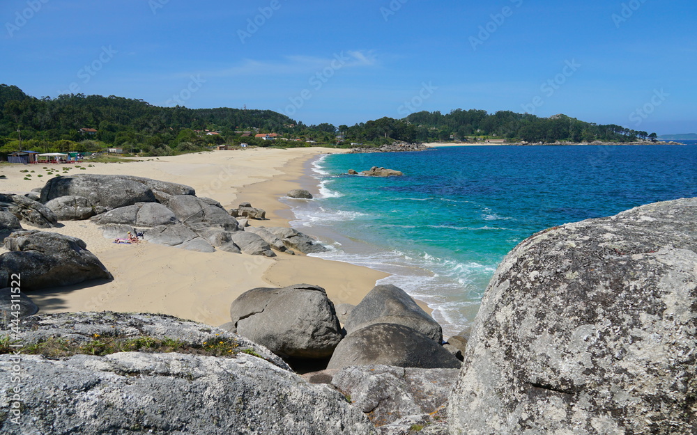 Spain Galicia coastline, sandy beach with large rocks, Atlantic ocean, Bueu, Praia de Tulla, Bueu, Pontevedra province