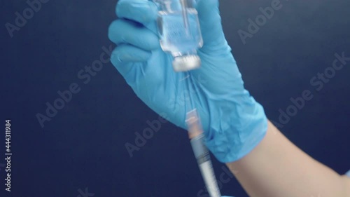 Close up shot of injection Doctors prepare antiviral drugs.