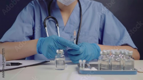 Close up shot of injection Doctors prepare antiviral drugs.