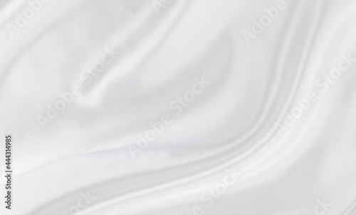 White gray satin texture that is white silver fabric silk background with beautiful soft blur pattern natural.