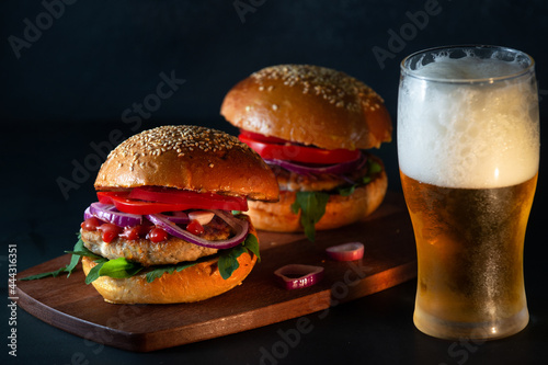 Burger beer snack fast food dark background