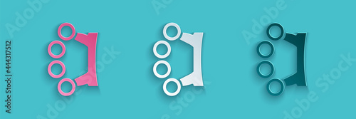 Paper cut Brass knuckles icon isolated on blue background. Paper art style. Vector
