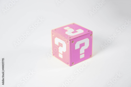 pink metal toy blocks with a question mark