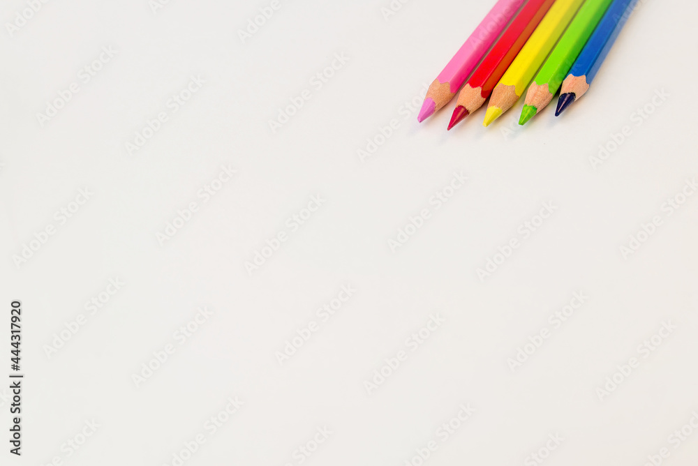 colored pencils on a white background copy the space. pencils for drawing on a white sheet of paper colored pencils on a white background copy the space. pencils for drawing on a white sheet of paper