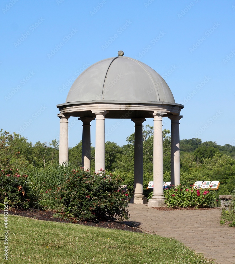 The stone domed gazebo in the park on a sunny day. The stone domed gazebo in the park on a sunny day.