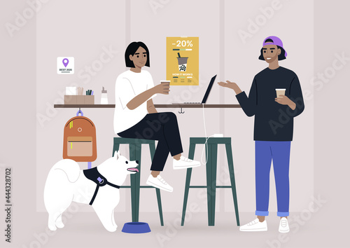 Two millennials chatting at the coffee shop bar counter, a dog-friendly place