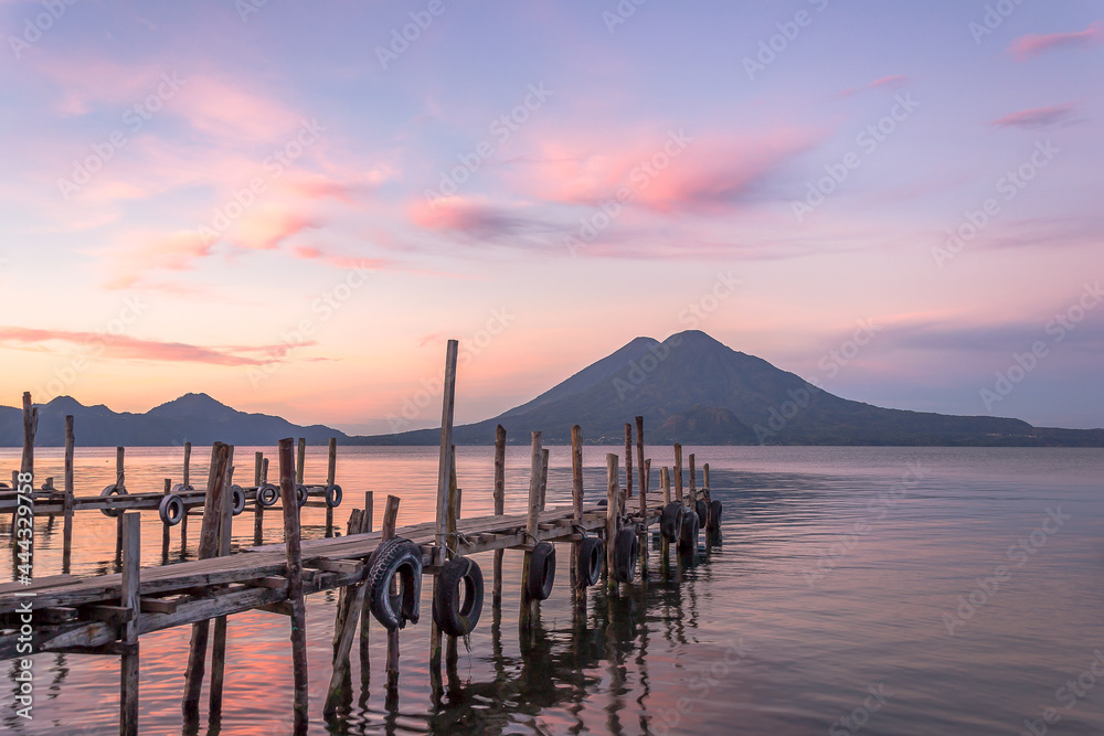 Spectacular and peaceful landscape of a sunrise at the docks of Panajachel, Lake Atitlán, in the Guatemalan highlands, Central America