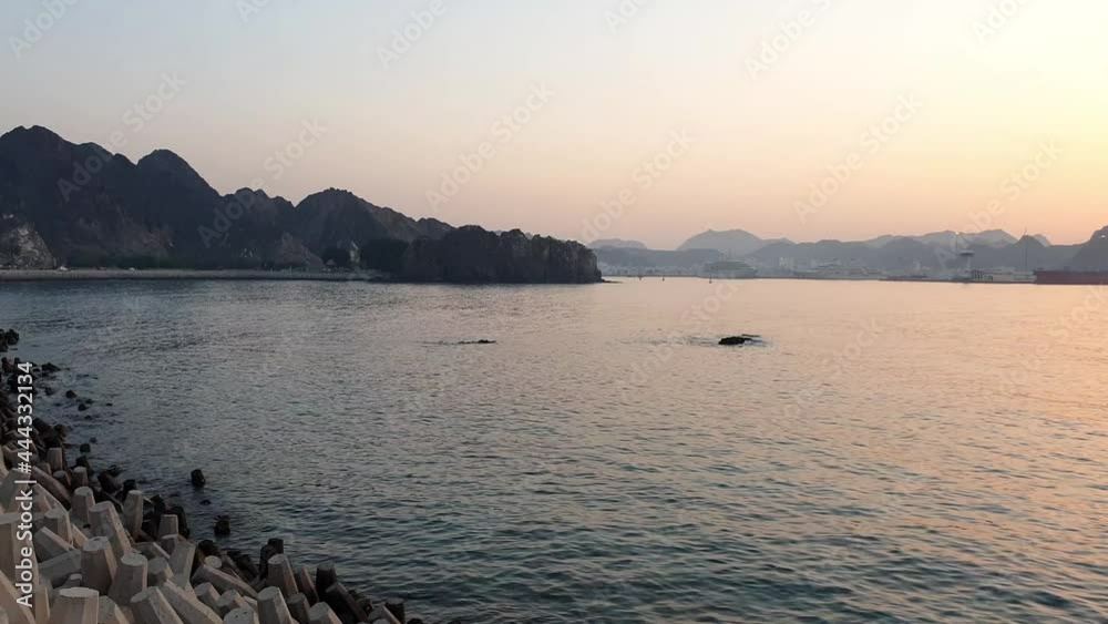 Evening sunset view in Muscat corniche with sea and mountain in background, Oman tourism. 4K video. Evening sunset view in Muscat corniche with sea and mountain in background, Oman tourism. 4K video.
