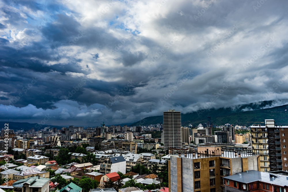 Fototapeta premium Moody sky over Tbilisi's downtown