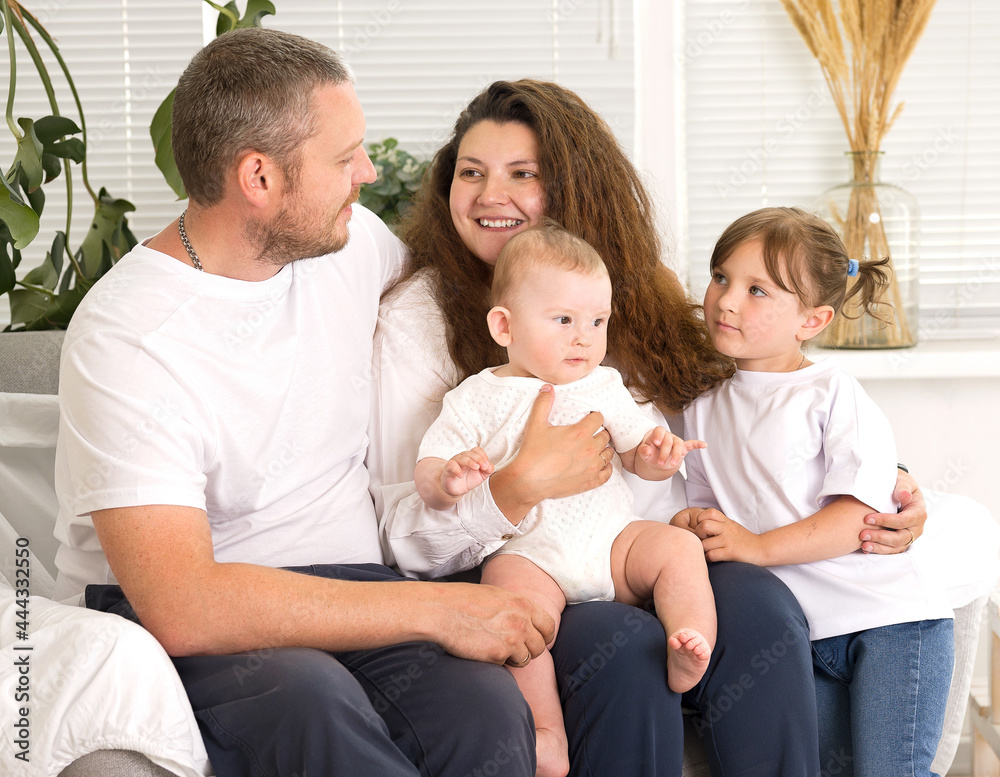 Happy family together at home, parents with their children at home Happy family together at home, parents with their children at home