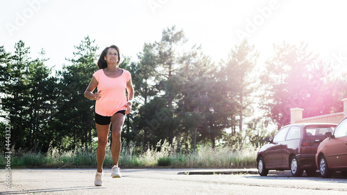 Smiling mature hispanic woman starting training photo