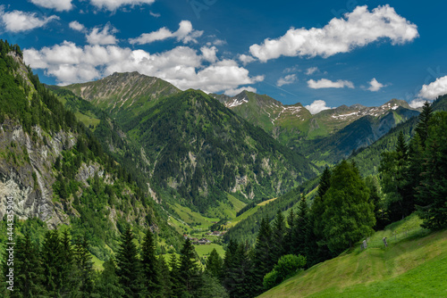 Summer valley with Grossarler Ache small river and blue cloudy sky © luzkovyvagon.cz
