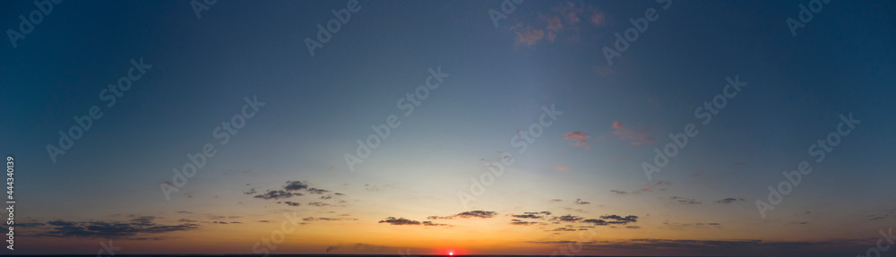 Orange sunset. Panorama of the evening sky.