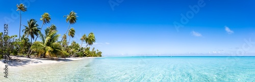 Tropical beach panorama with turquoise sea and blue sky