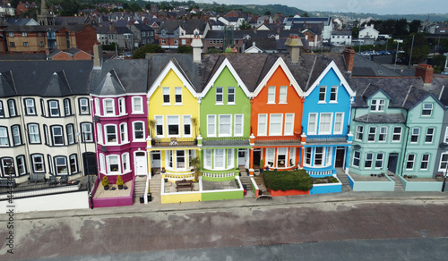 Yellow Red Orange Green Blue sky houses by the sea aerial Whitehead N. Ireland