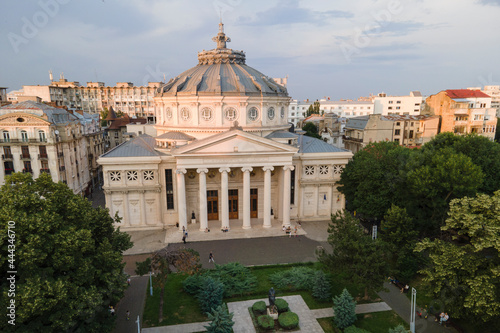 Aerial drone view of The Romanian Athenaeum George Enescu (Ateneul Roman) in Bucharest, Romania. Most prestigious concert hall and one of the most beautiful buildings in the city in the sunset. photo