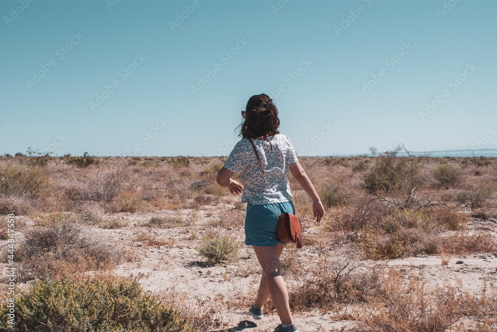 Young Woman walking in the Sonoran Desert Young Woman walking in the Sonoran Desert