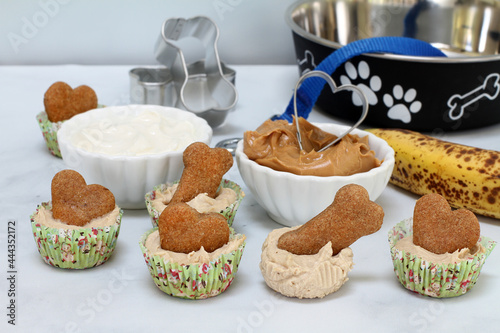 Dog Ice Cream cupcakes with a biscuit.  Yogurt, banana and peanut butter in the image.