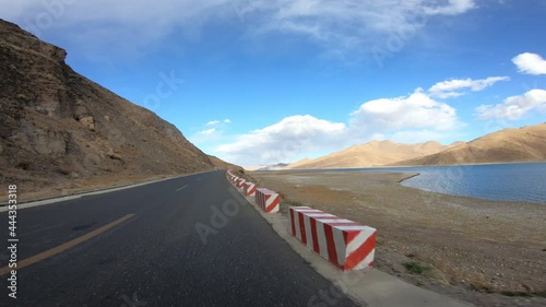 Driving on the trail beside yamdrok lake in tibet, China photo