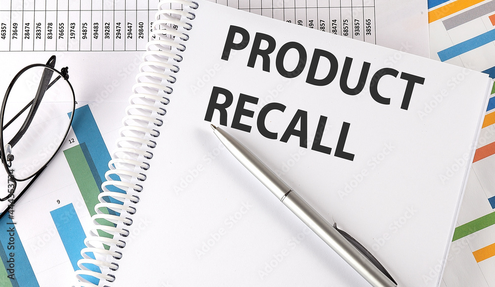 PRODUCT RECALL text , pen and glasses on the chart