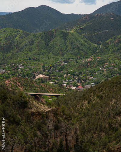 amazing bridge with mountains and trees in background during summer © Aon Prestige Media
