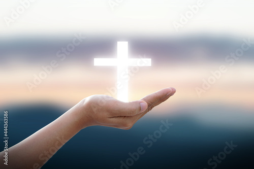 Hands bless the cross in the sky.Belief in Jesus Christ.Man hands palm up praying and worship of cross, eucharist therapy bless god helping, hope and faith, christian religion concept 