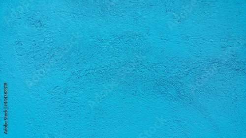 Abstract texture of blue-green plaster on the walls. Concrete screed. The background image. Copy the place for the text. Construction design surface. Rough wallpaper.