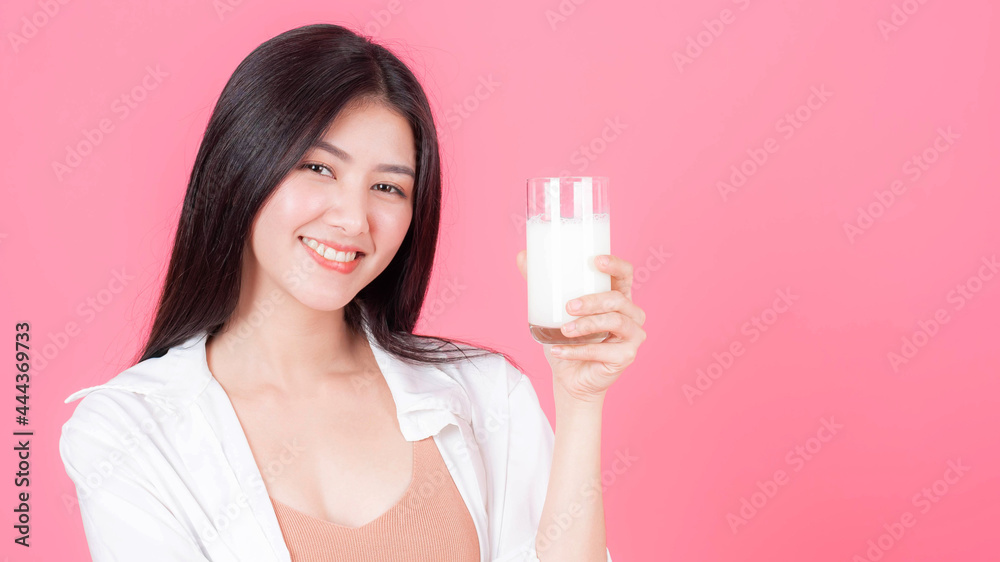 beauty woman Asian cute girl feel happy drinking milk for good health in the morning on pink background - lifestyle beauty woman c beauty woman Asian cute girl feel happy drinking milk for good health in the morning on pink background - lifestyle beauty woman c