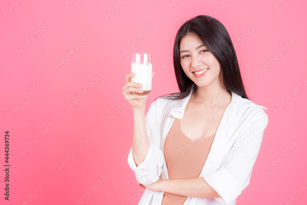 beauty woman Asian cute girl feel happy drinking milk for good health in the morning on pink background - lifestyle beauty woman c beauty woman Asian cute girl feel happy drinking milk for good health in the morning on pink background - lifestyle beauty woman c