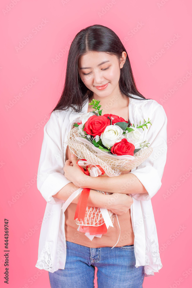 beauty woman Asian cute girl feel happy holding flower red rose and white rose on pink background - lifestyle beautiful woman beauty woman Asian cute girl feel happy holding flower red rose and white rose on pink background - lifestyle beautiful woman