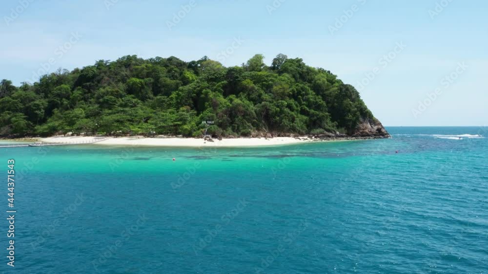 A view from passenger ferry of the blue sea and the island in the middle of the sea. A view from passenger ferry of the blue sea and the island in the middle of the sea.