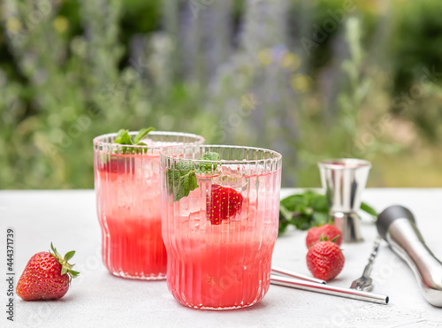 Summer garden drink. Strawberry and mint cocktail or mocktail with ice