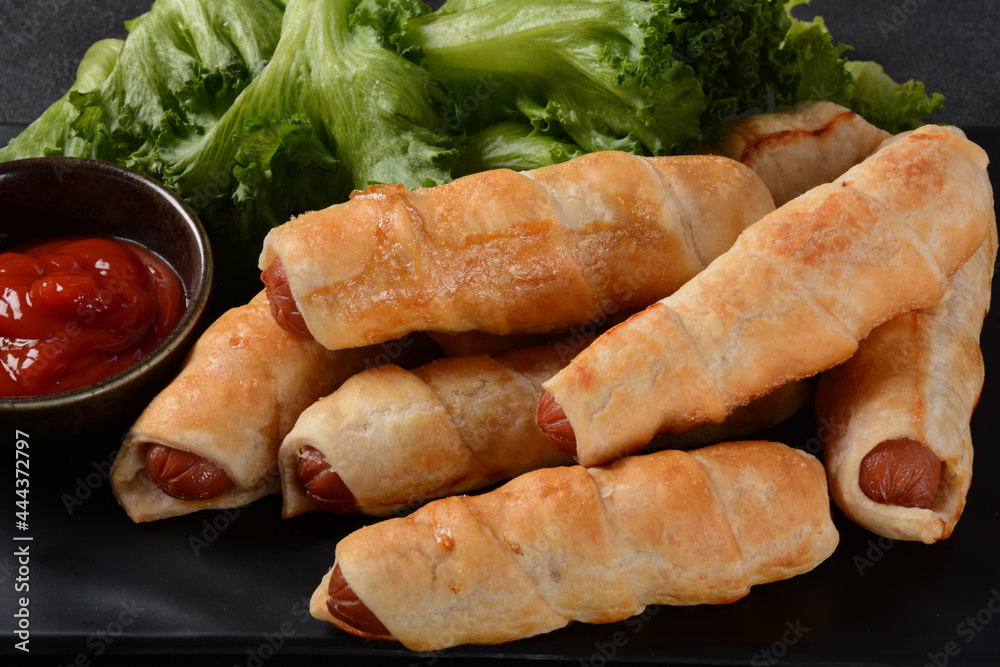 Sausage buns. Soft baked bun (dough )stuffed with pork sausage for fast food breakfast or coffee break. Sausage roll, (hot dog). Sausage buns. Soft baked bun (dough )stuffed with pork sausage for fast food breakfast or coffee break. Sausage roll, (hot dog).