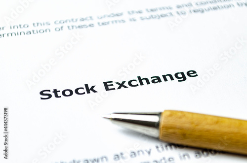Words stock exchange with wooden pen