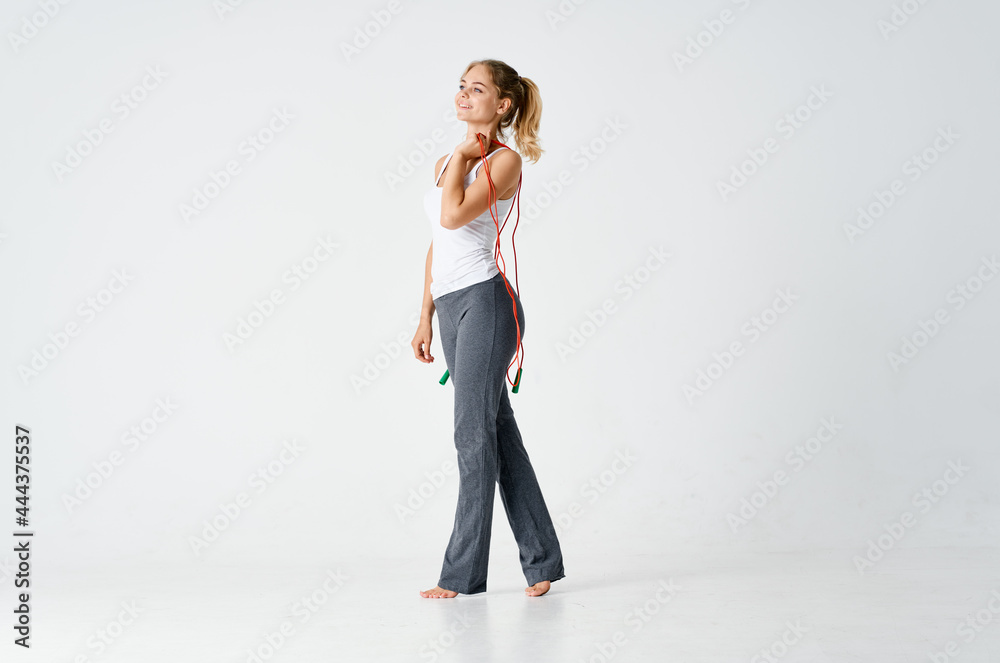 woman doing fitness energy skipping rope workout exercise