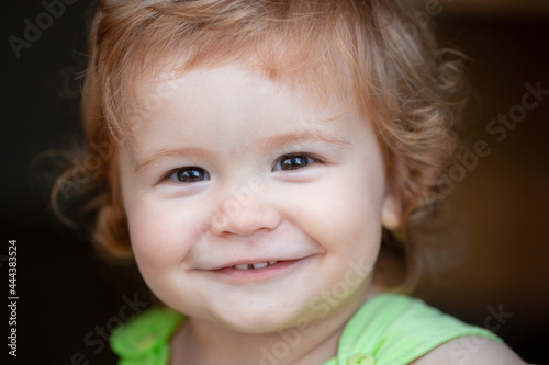 Smiling infant, cute smile. Kids baby macro portrait, close up head of cute child.