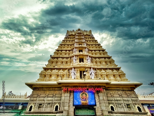 Chamundeshwari temple gopura with cloudy sky background. photo