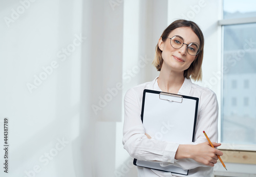 pretty business woman in white shirt office documents professional