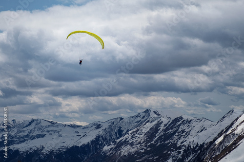 paragliding in mountains near Gudauri in Georgia