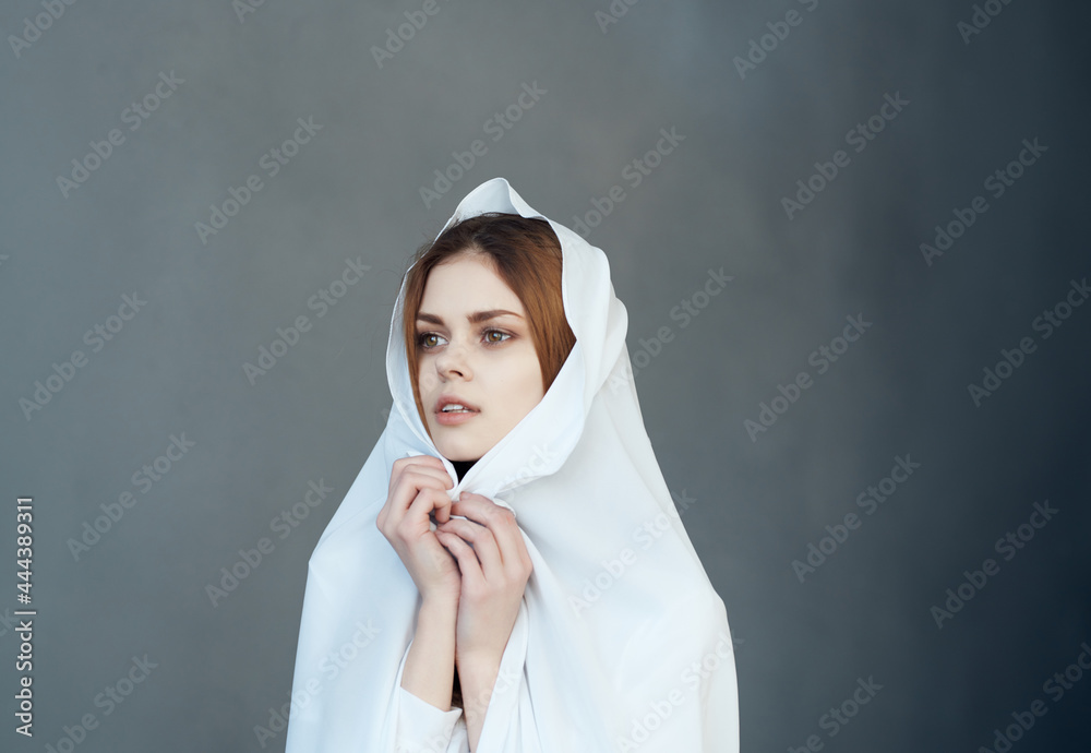 pretty woman covers herself with white cloth with head makeup fashion studio pretty woman covers herself with white cloth with head makeup fashion studio