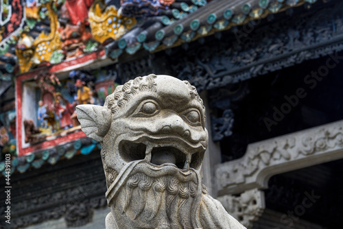 A close-up of a stone lion in the Chen Clan Temple in Guangzhou, stone carving art