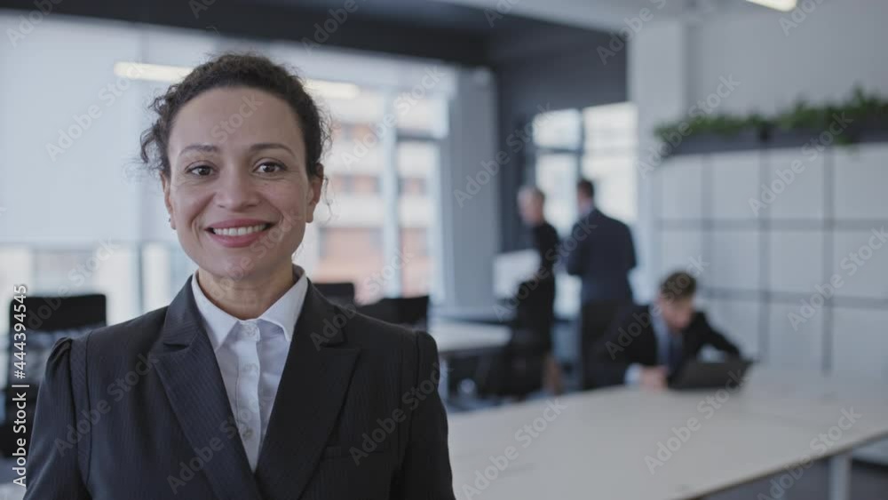 Happy businesswoman taking off face mask employees back to office after lockdown Happy businesswoman taking off face mask employees back to office after lockdown